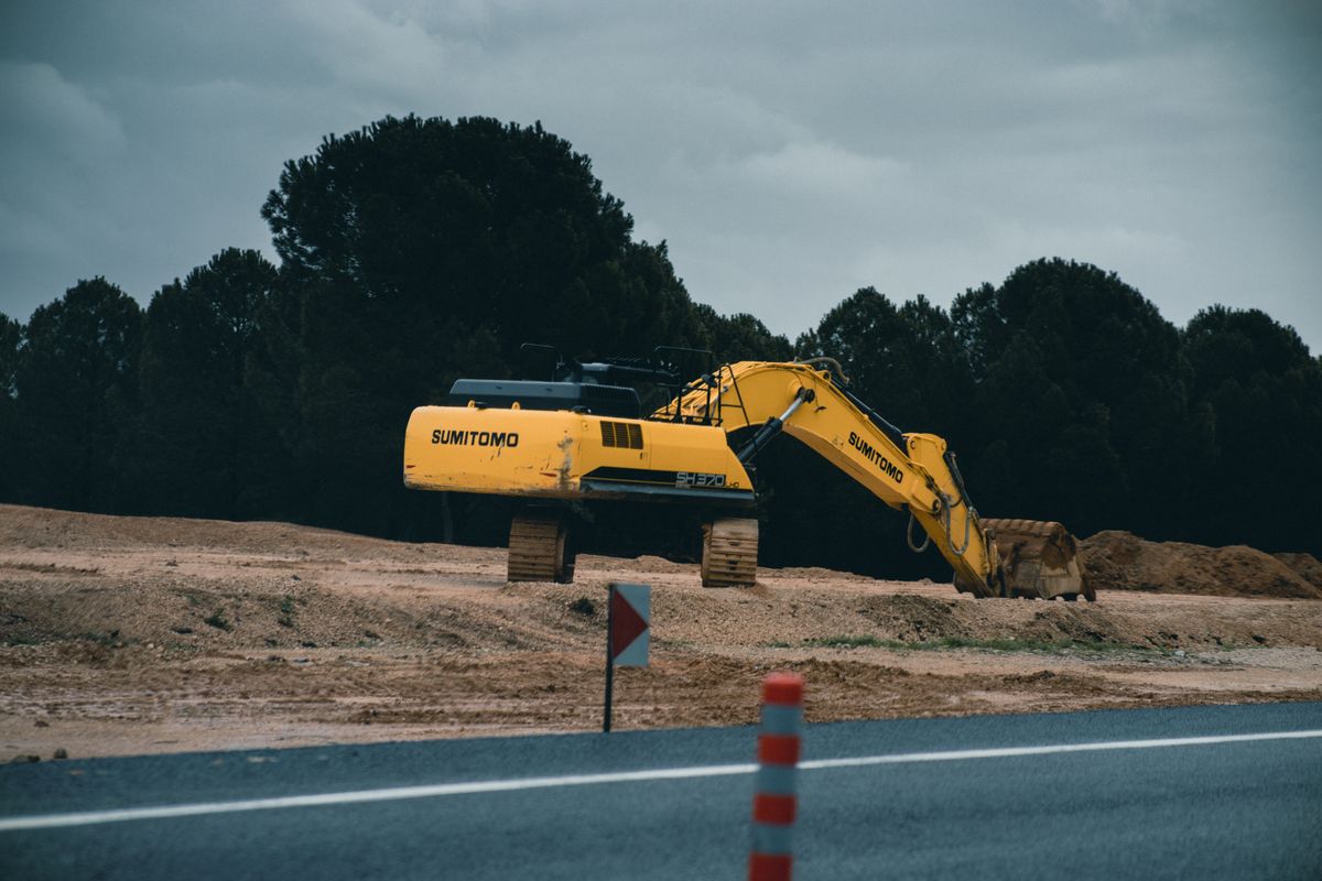 Excavator on cleared land